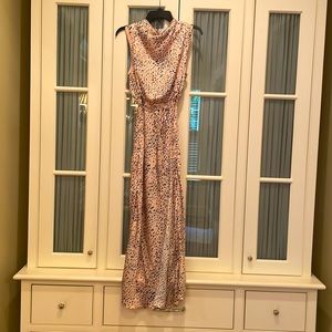 Esmaee midi dress; light blush background with white and black animal print;